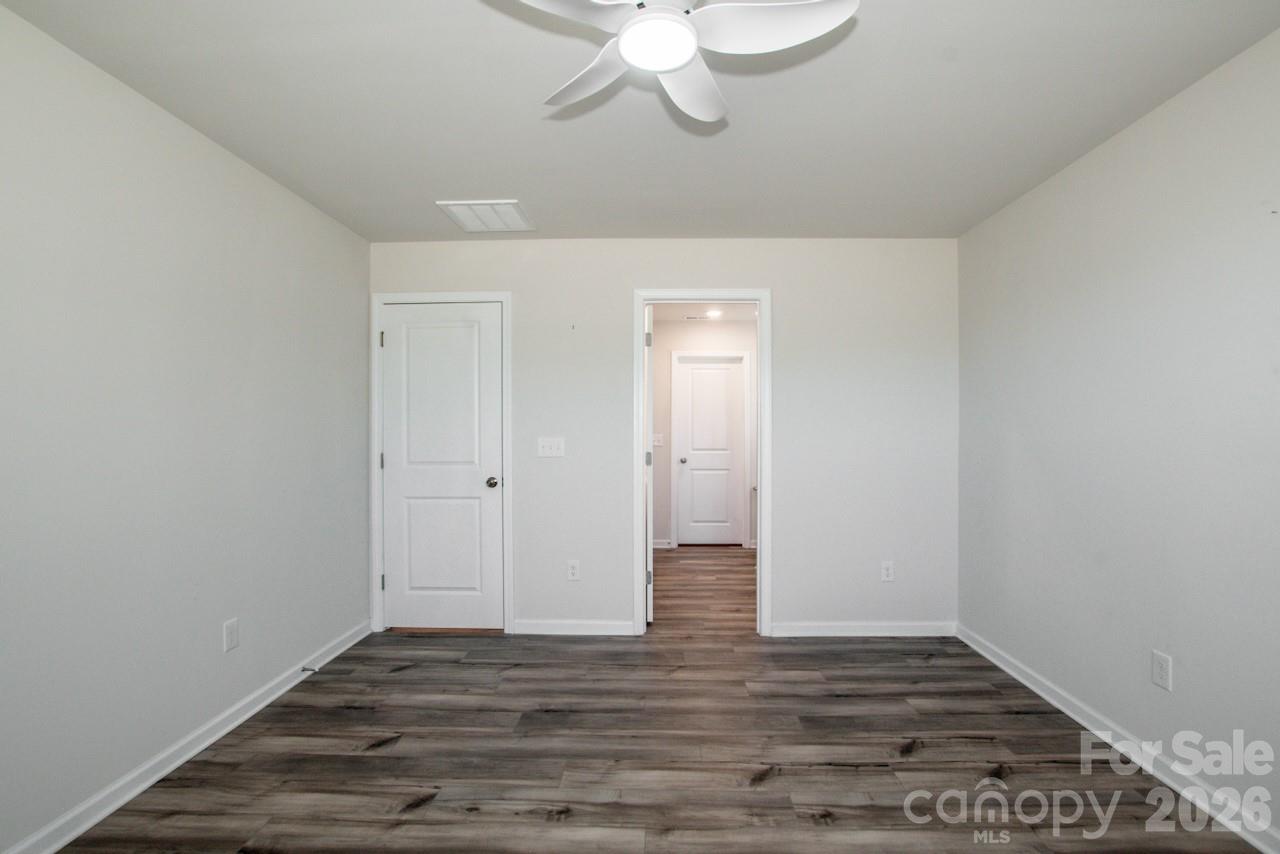 2742 Legacy Ridge Lane Catawba, NC 28609 - Photo 25 of 36 a view of an empty room with wooden floor and a window