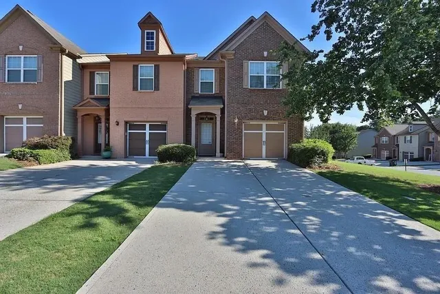 a front view of a house with a yard