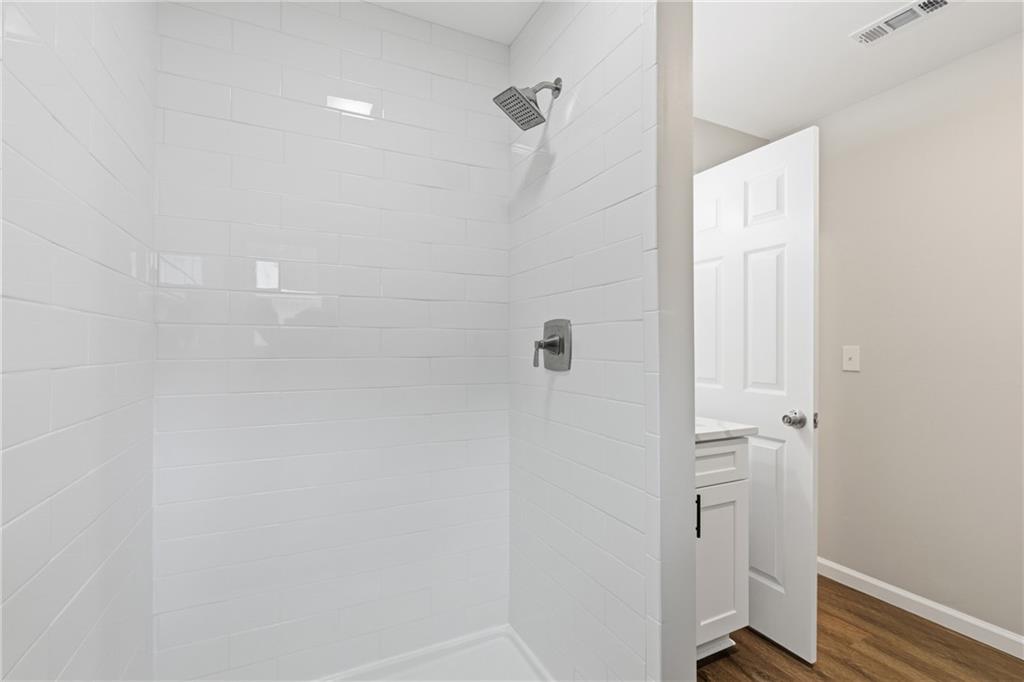 151 Richardson Street Toccoa, GA 30577 - Photo 14 of 36 a bathroom with a shower