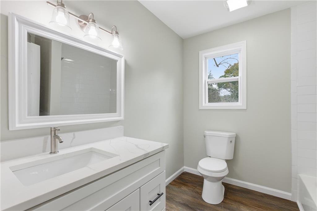 151 Richardson Street Toccoa, GA 30577 - Photo 22 of 36 a bathroom with a sink and a mirror
