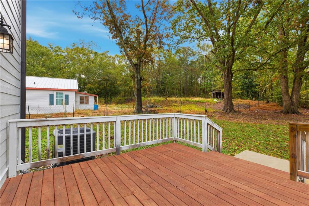 151 Richardson Street Toccoa, GA 30577 - Photo 25 of 36 a view of a wooden deck with a yard
