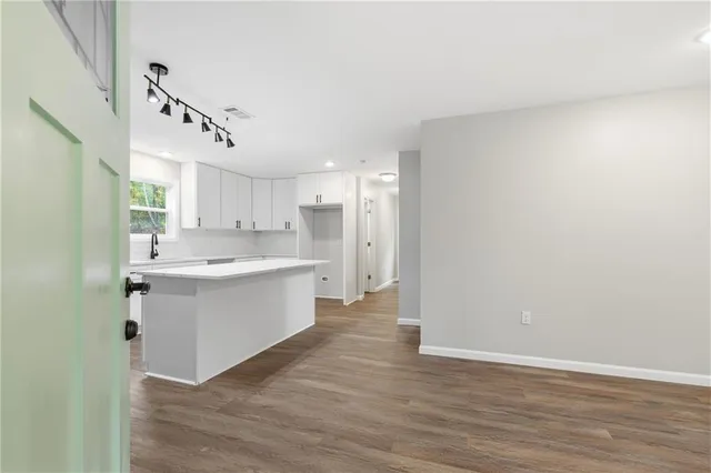 a view of kitchen with wooden floor