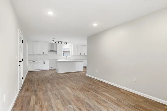a view of kitchen with wooden floor