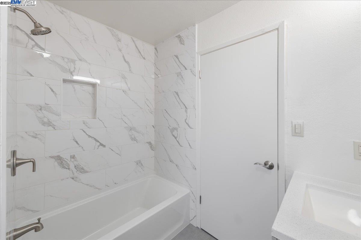3214 13th Avenue Oakland, CA 94610 - Photo 12 of 51 a bathroom with a bathtub