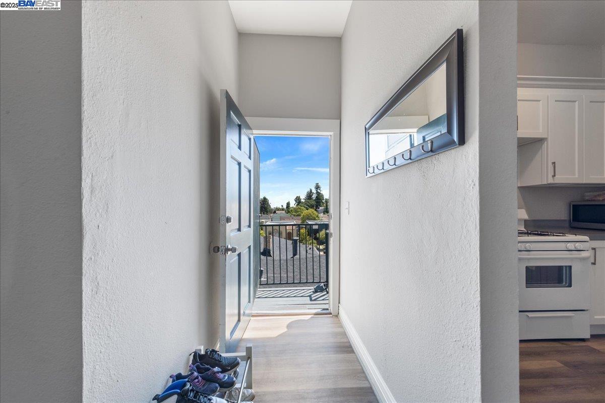 3214 13th Avenue Oakland, CA 94610 - Photo 15 of 51 a view of a hallway and an dining rom with furniture