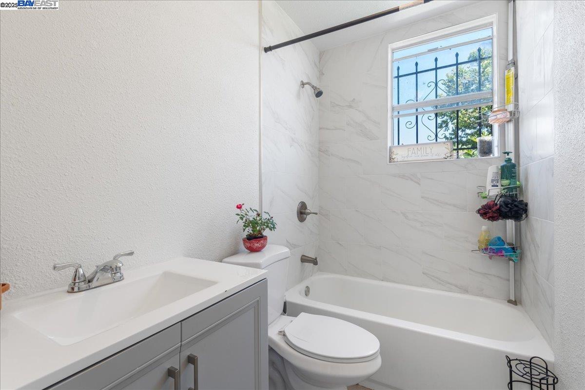 3214 13th Avenue Oakland, CA 94610 - Photo 21 of 51 a bathroom with a sink toilet and bathtub