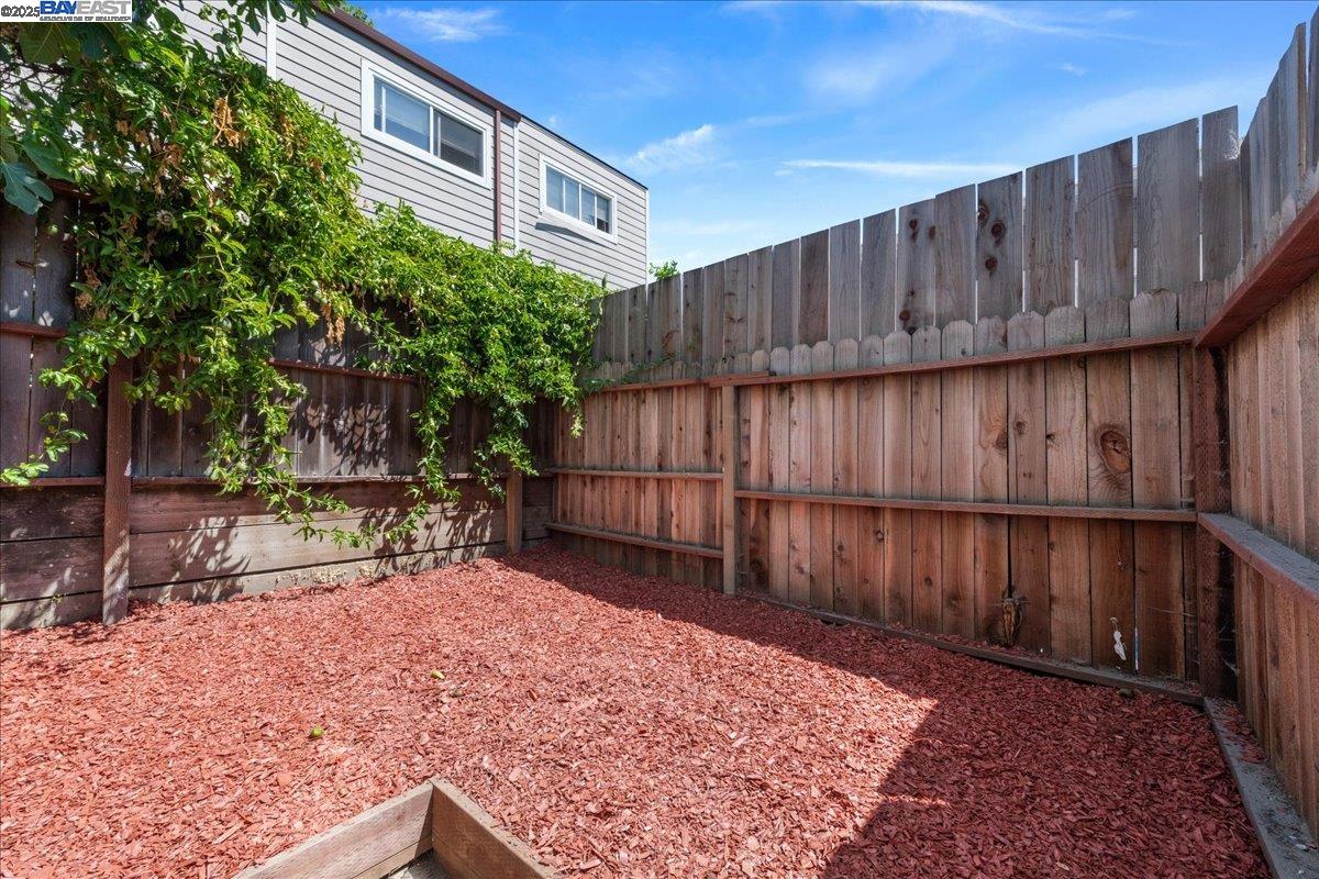3214 13th Avenue Oakland, CA 94610 - Photo 26 of 51 a view of a backyard with wooden fence