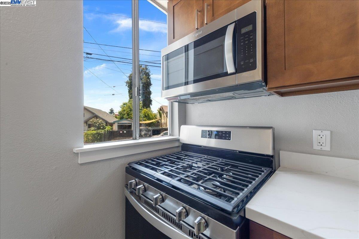 3214 13th Avenue Oakland, CA 94610 - Photo 35 of 51 a stove top oven sitting inside of a kitchen