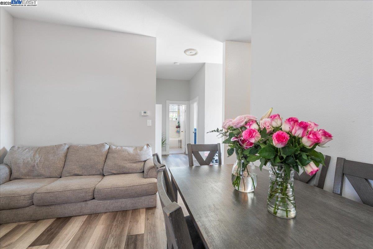 3214 13th Avenue Oakland, CA 94610 - Photo 38 of 51 a living room with furniture and flowers