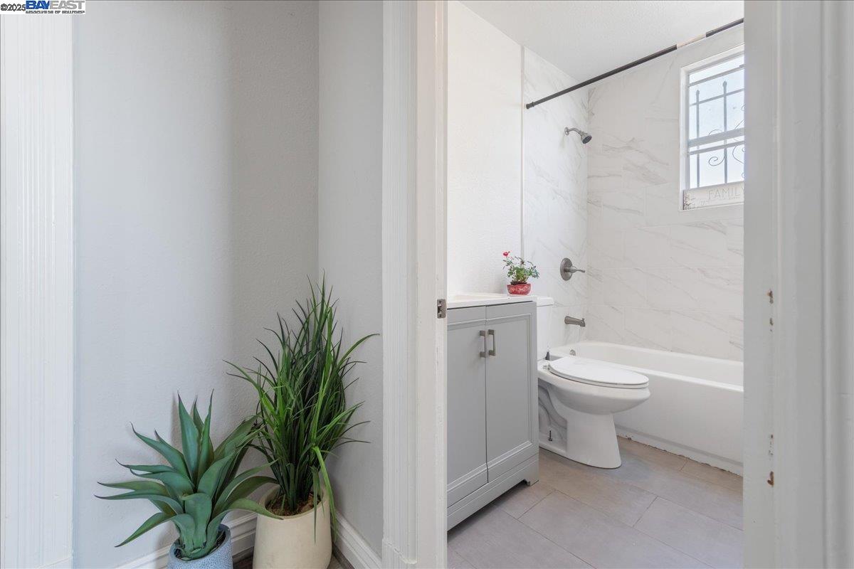 3214 13th Avenue Oakland, CA 94610 - Photo 39 of 51 a bathroom with a toilet a sink and a shower
