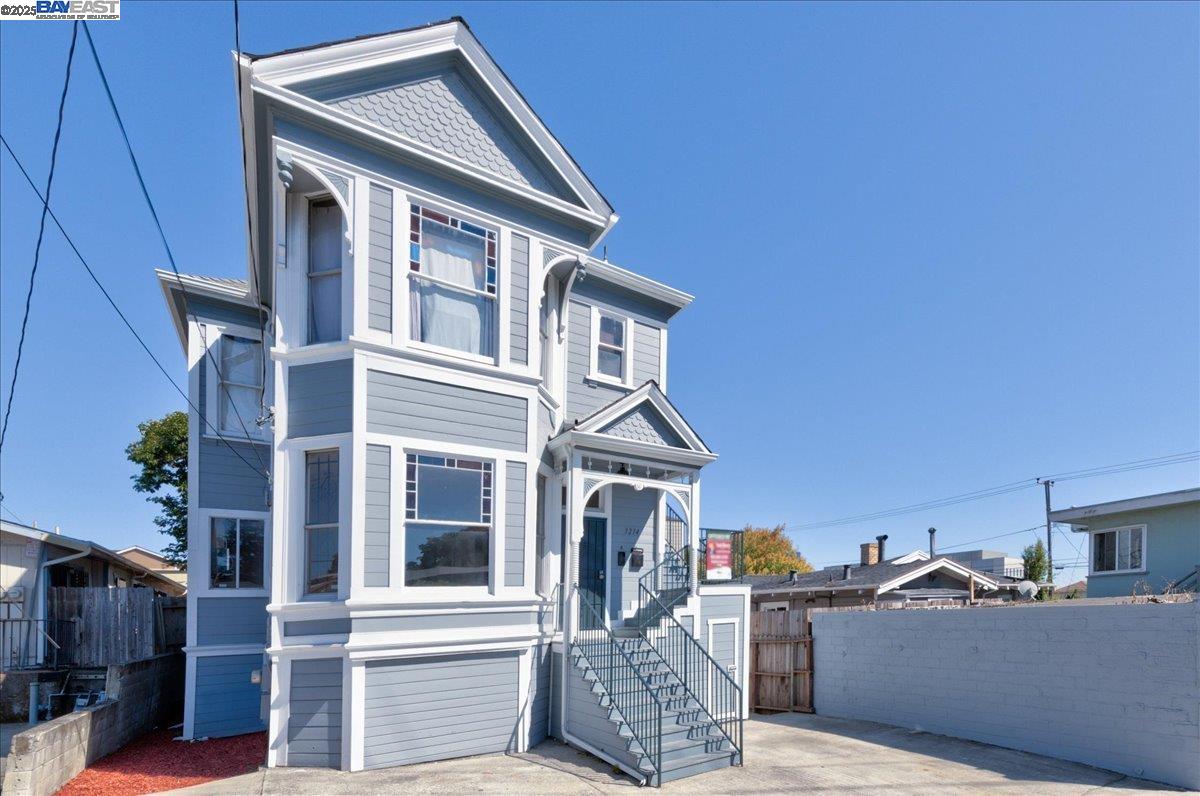3214 13th Avenue Oakland, CA 94610 - Photo 50 of 51 a view of a house with a door and wooden fence