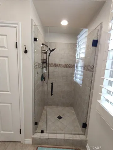 a bathroom with a sink toilet and a mirror