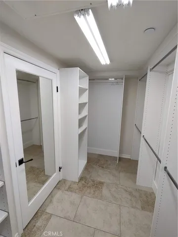 a view of a patio with table and chairs and potted plants