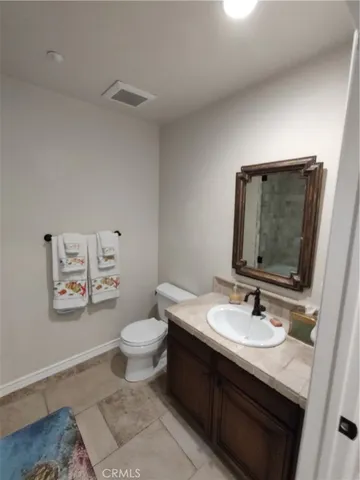 a dining room with furniture and a floor to ceiling window