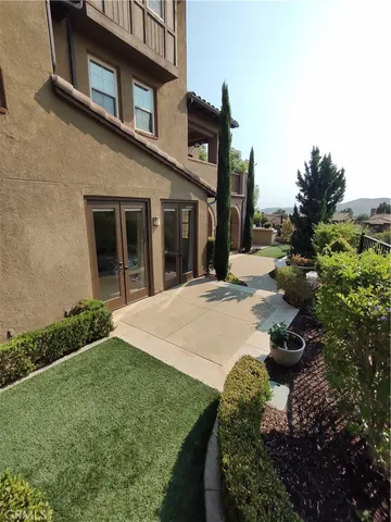 a front view of a house with yard