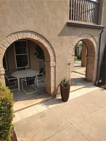 a view of a car park in front of a house