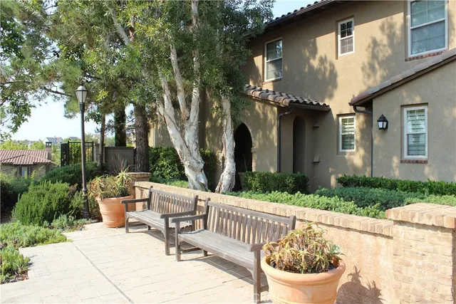 a view of a chair and tables in the patio with a fire pit