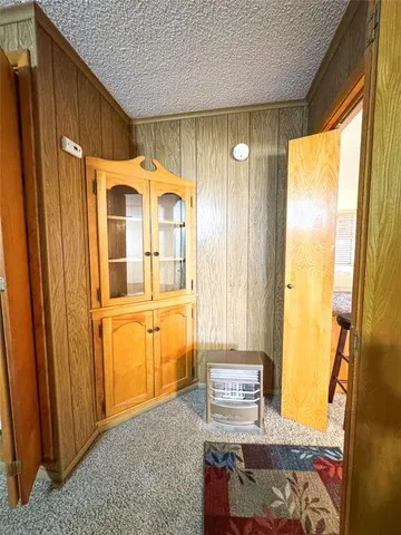 a kitchen with a sink a stove top oven a refrigerator and a window