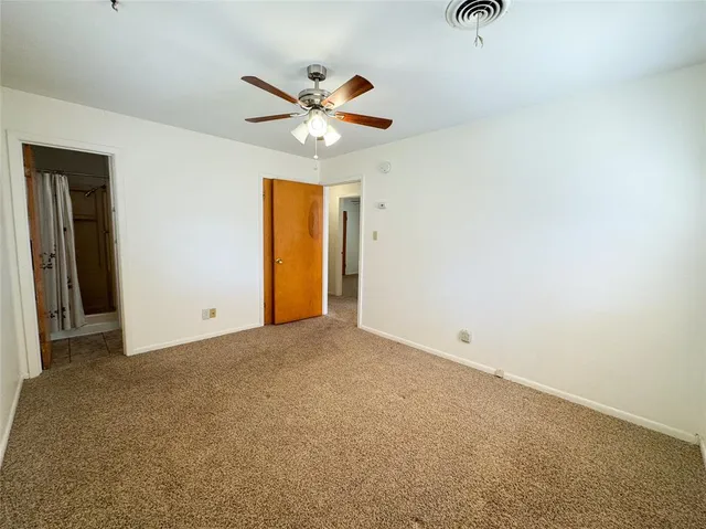 a bathroom with a toilet a sink and a mirror