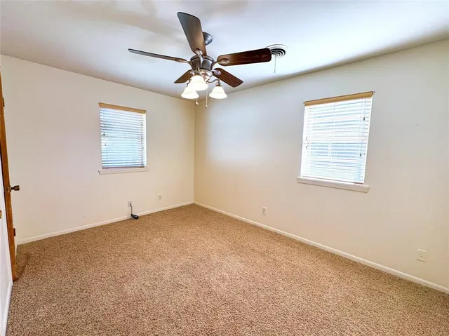 a view of a big room with wooden floor and closet