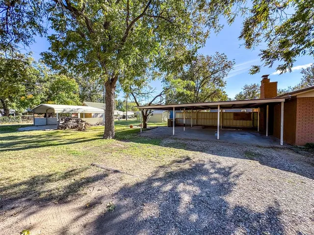 a view of a room with wooden walls