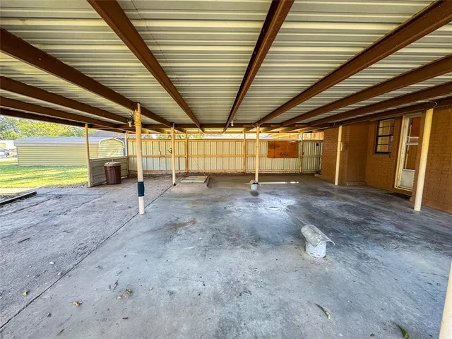 an empty room with wooden walls