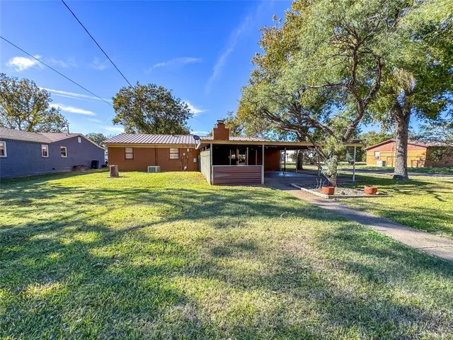 a view of a house with a swimming pool
