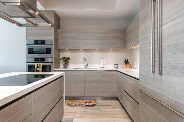 a kitchen with a sink and cabinets