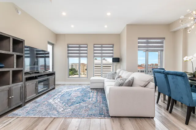 a living room with furniture and a large window