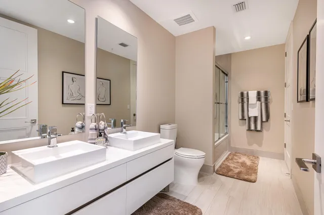 a bathroom with a sink toilet and shower