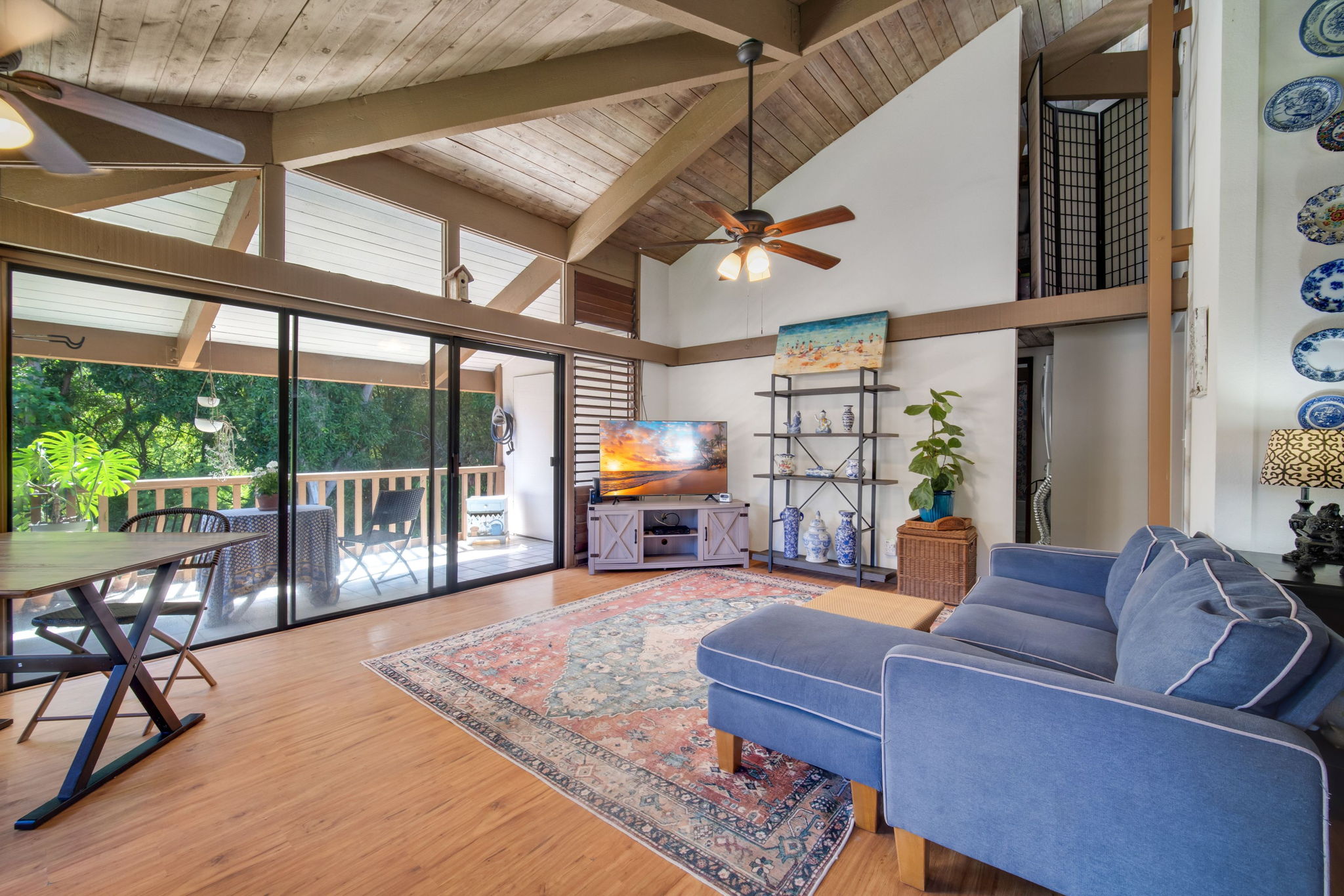 4701 Kawaihau Road, Unit F201 Kapaa, HI 96746 - Photo 1 of 24 a living room with furniture a fireplace and a table