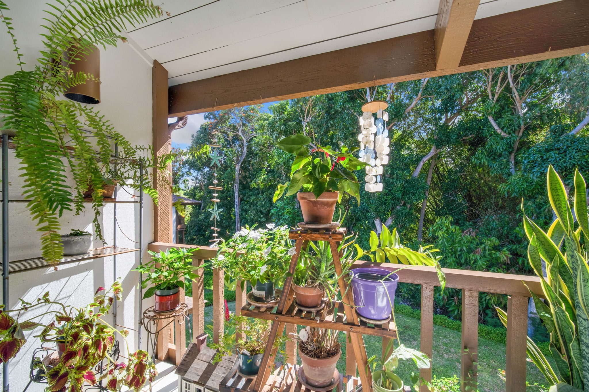 4701 Kawaihau Road, Unit F201 Kapaa, HI 96746 - Photo 11 of 24 a view of a chairs and table in a yard