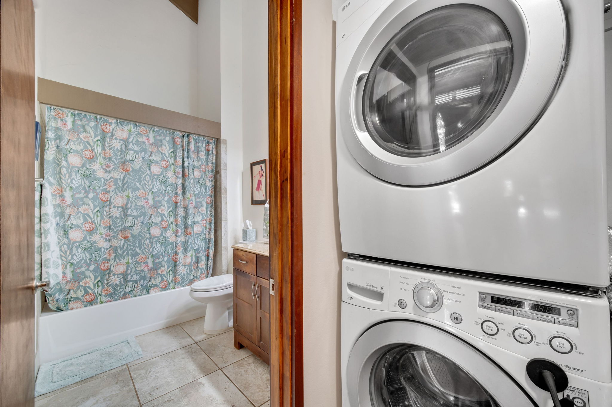 4701 Kawaihau Road, Unit F201 Kapaa, HI 96746 - Photo 13 of 24 a view of a hallway with washer and dryer