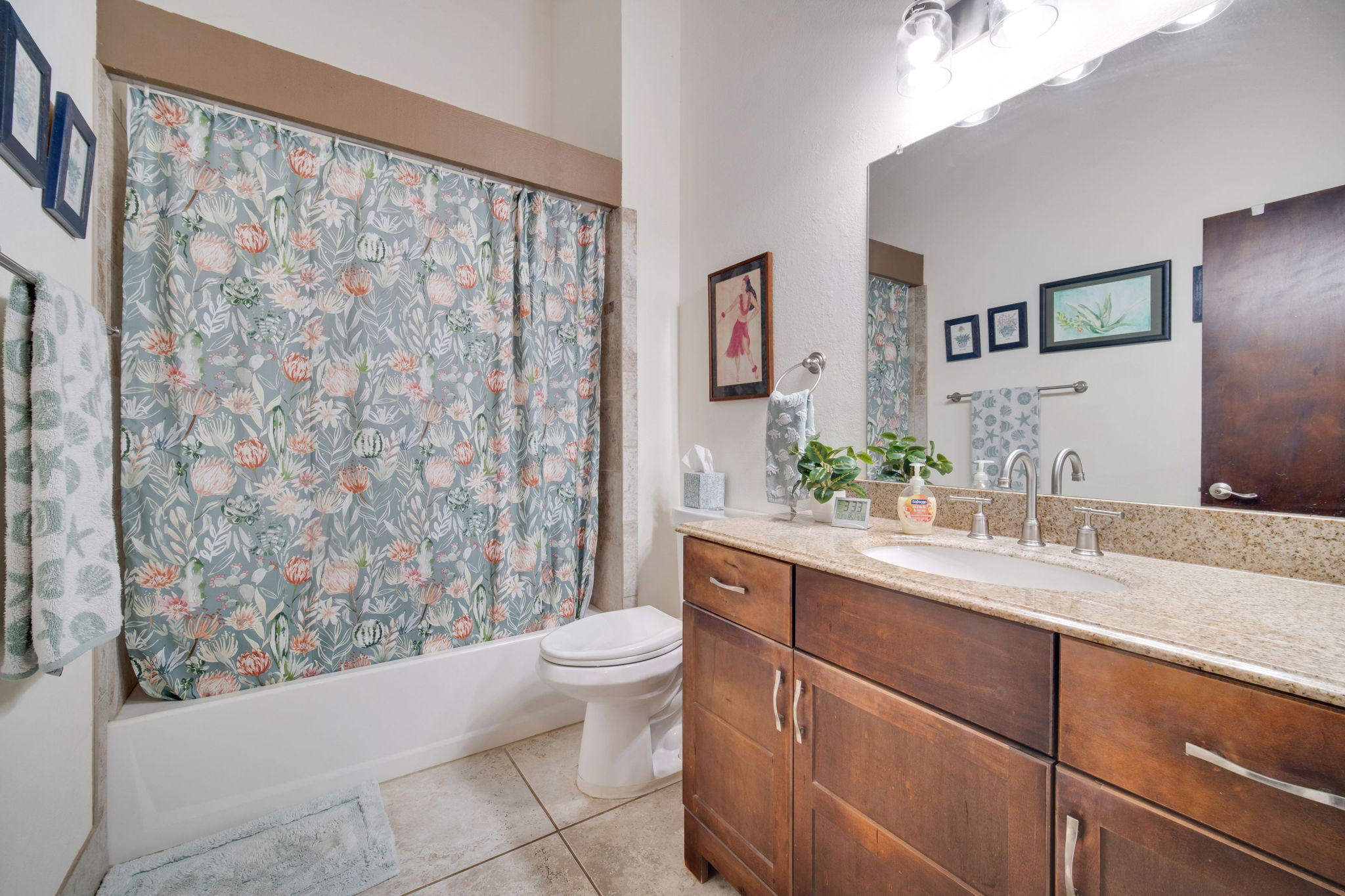 4701 Kawaihau Road, Unit F201 Kapaa, HI 96746 - Photo 14 of 24 a bathroom with a granite countertop sink and a mirror