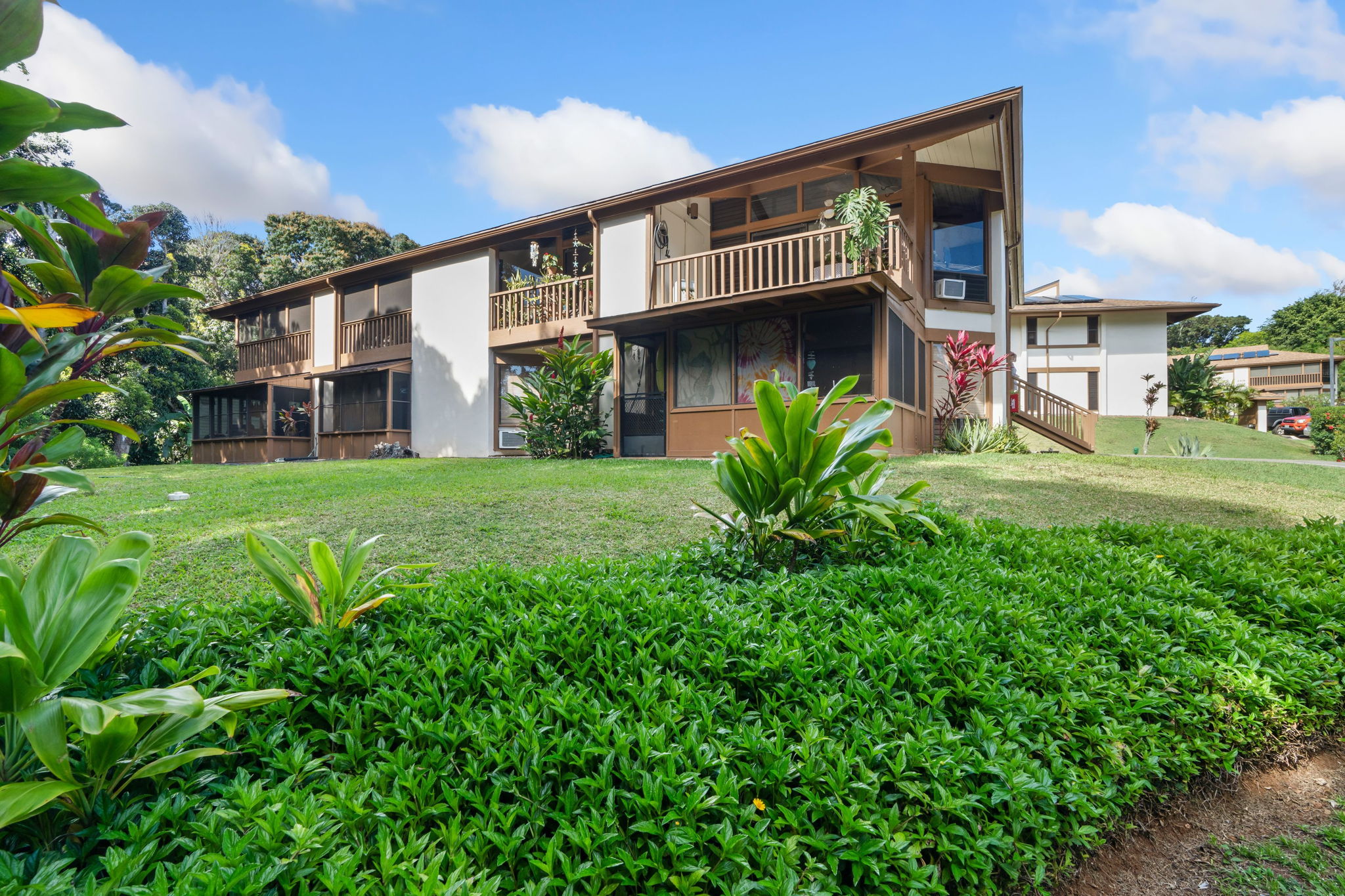 4701 Kawaihau Road, Unit F201 Kapaa, HI 96746 - Photo 20 of 24 a front view of a house with garden