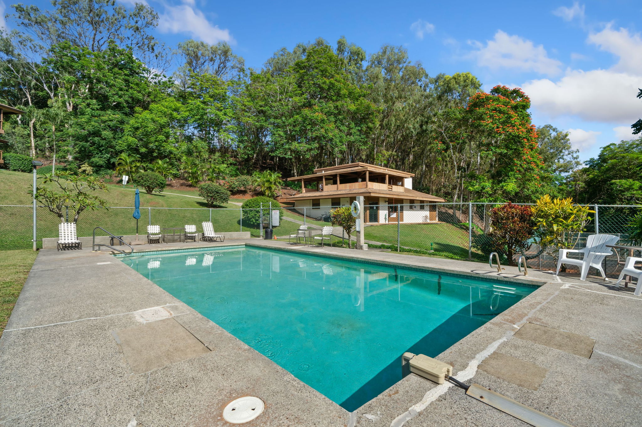 4701 Kawaihau Road, Unit F201 Kapaa, HI 96746 - Photo 21 of 24 a view of a swimming pool with a patio