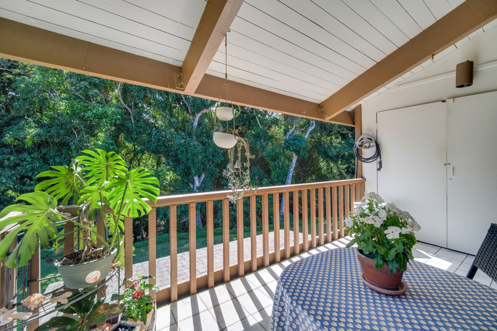 4701 Kawaihau Road, Unit F201 Kapaa, HI 96746 - Photo 3 of 24 a view of a chair in wooden deck