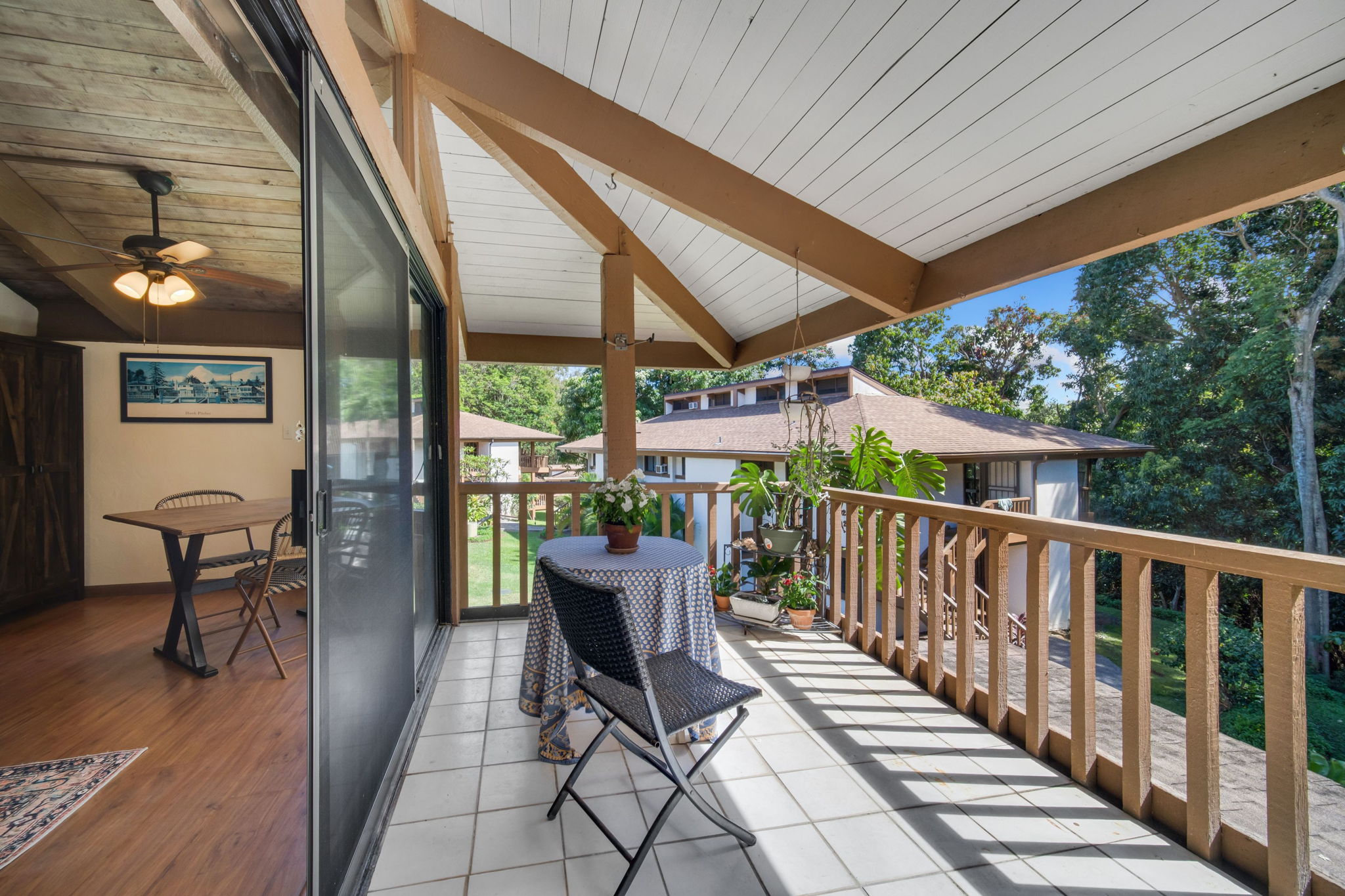 4701 Kawaihau Road, Unit F201 Kapaa, HI 96746 - Photo 4 of 24 a view of a chairs and table in the balcony