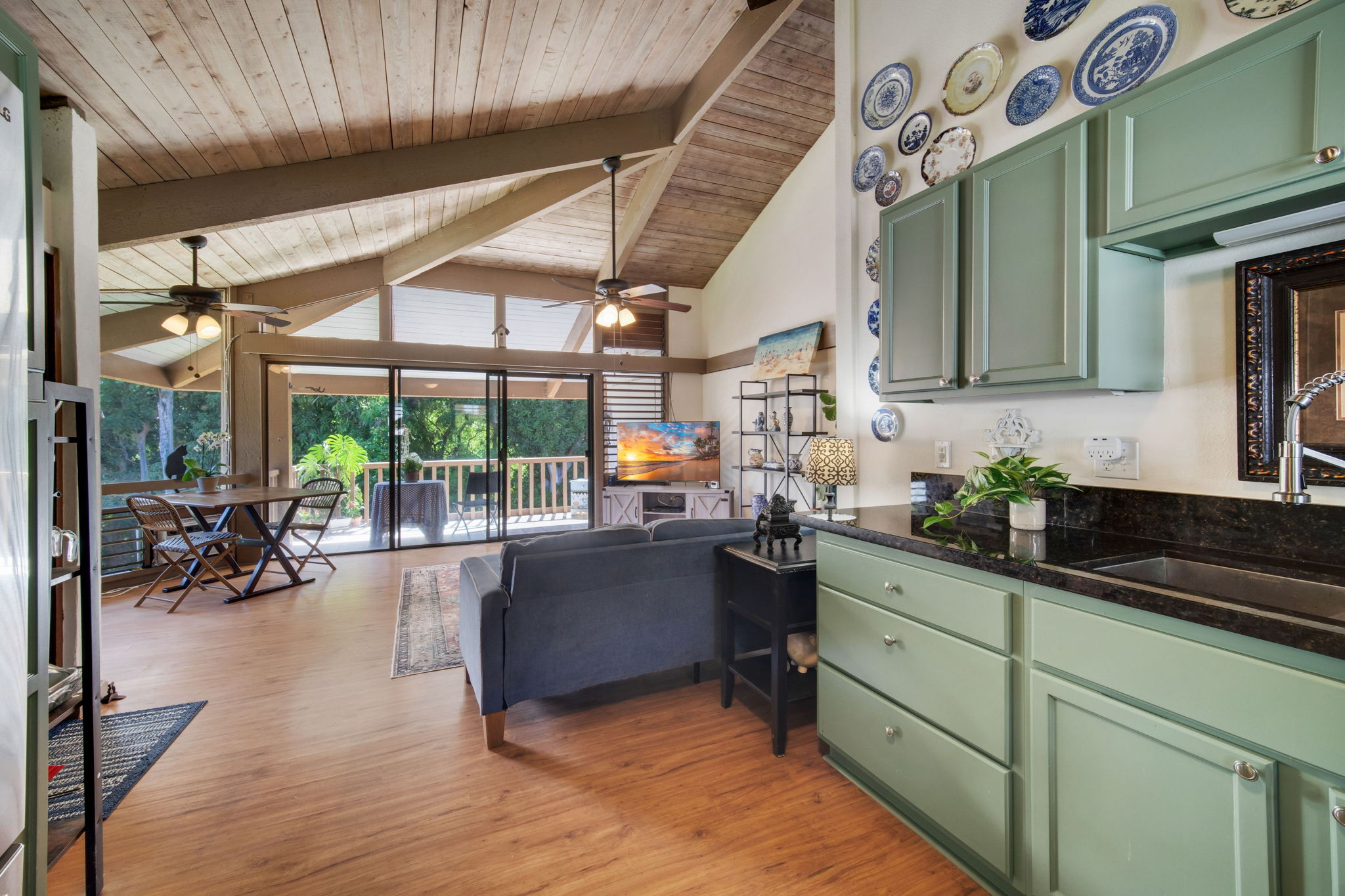 4701 Kawaihau Road, Unit F201 Kapaa, HI 96746 - Photo 6 of 24 a kitchen with sink cabinets and outdoor living room