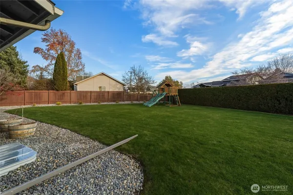 a view of a house with a big yard