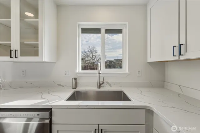 a kitchen with a sink and a window