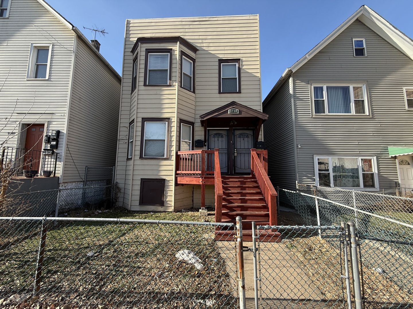a front view of a house with stairs
