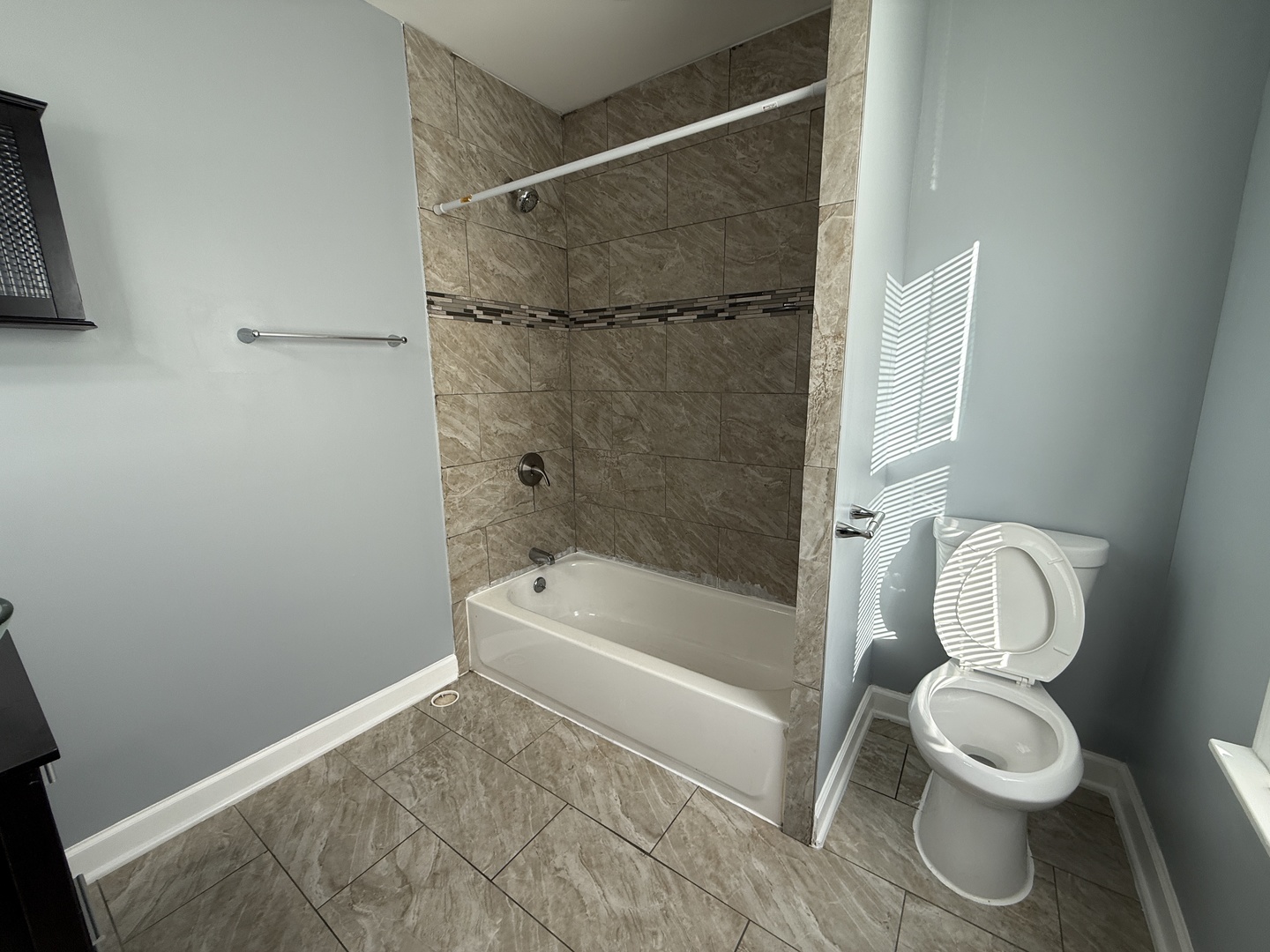 9738 South Ave L, Unit 2 Chicago, IL 60617 - Photo 8 of 11 a bathroom with a toilet and a shower