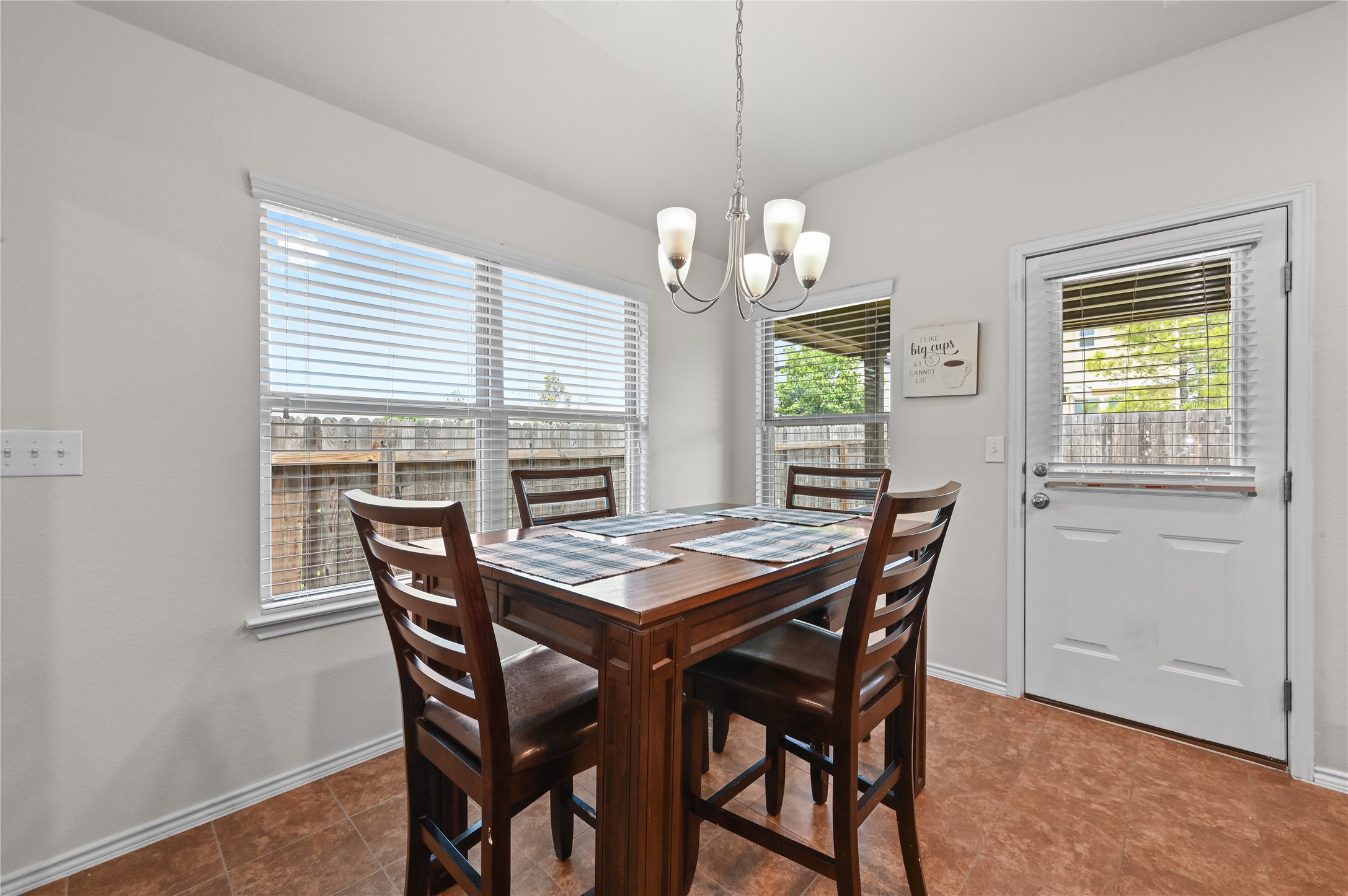 303 Limerick Road Buda, TX 78610 - Photo 6 of 23 Dining area featuring warm-toned tile flooring and neutral wall tones