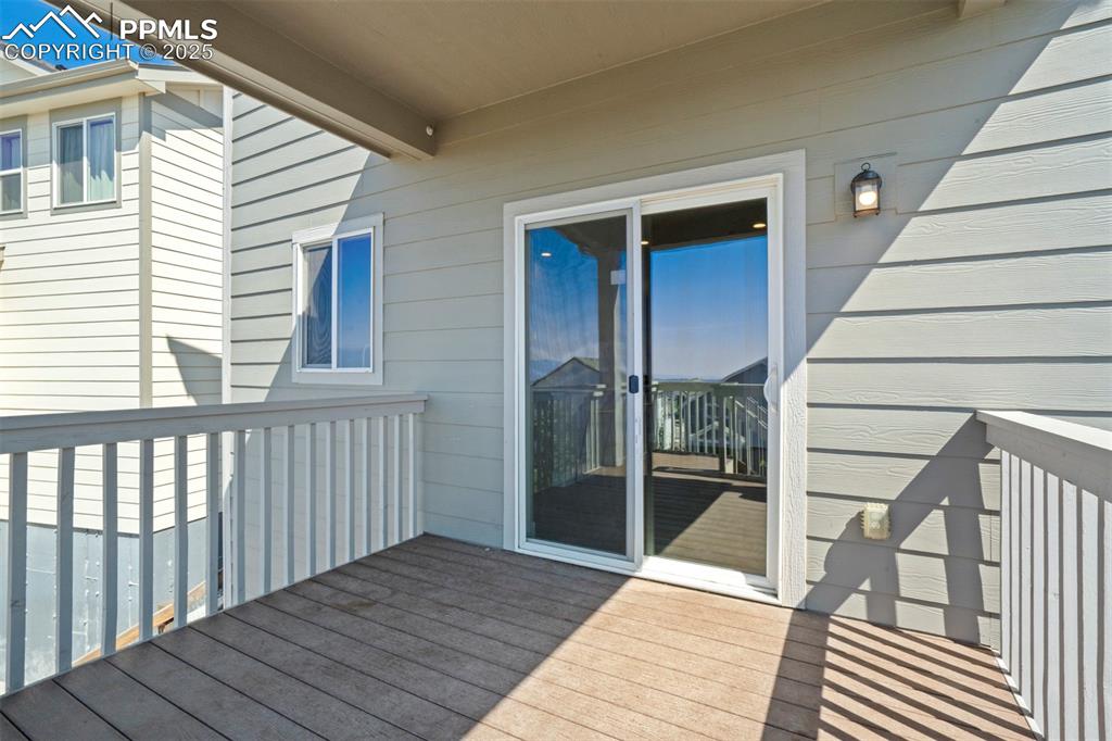5633 Makalu Drive Colorado Springs, CO 80924 - Photo 17 of 48 a view of a balcony with wooden floor