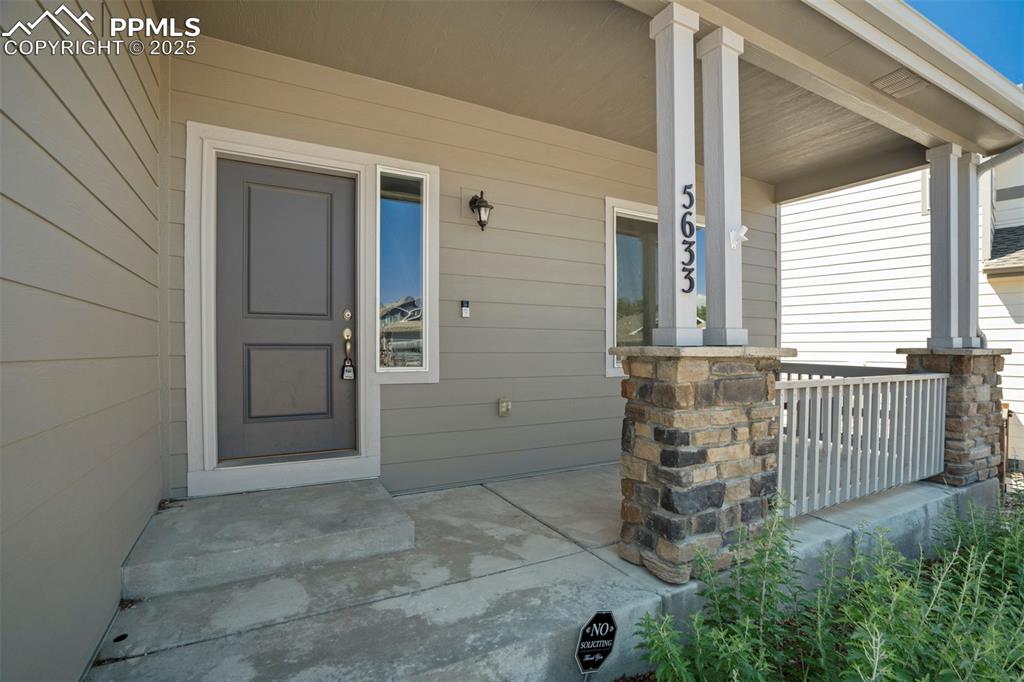 5633 Makalu Drive Colorado Springs, CO 80924 - Photo 2 of 48 front view of a house with a porch