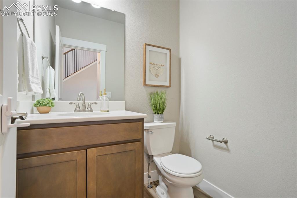 5633 Makalu Drive Colorado Springs, CO 80924 - Photo 21 of 48 a bathroom with a sink toilet and a mirror