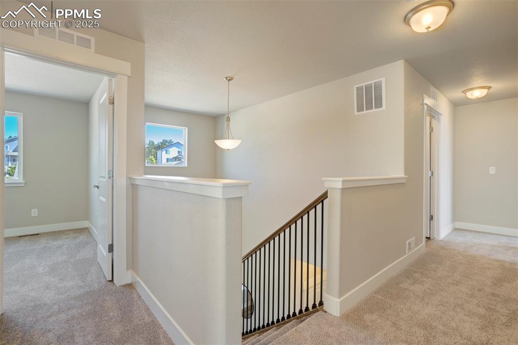5633 Makalu Drive Colorado Springs, CO 80924 - Photo 30 of 48 a view of a hallway with entryway and stairs