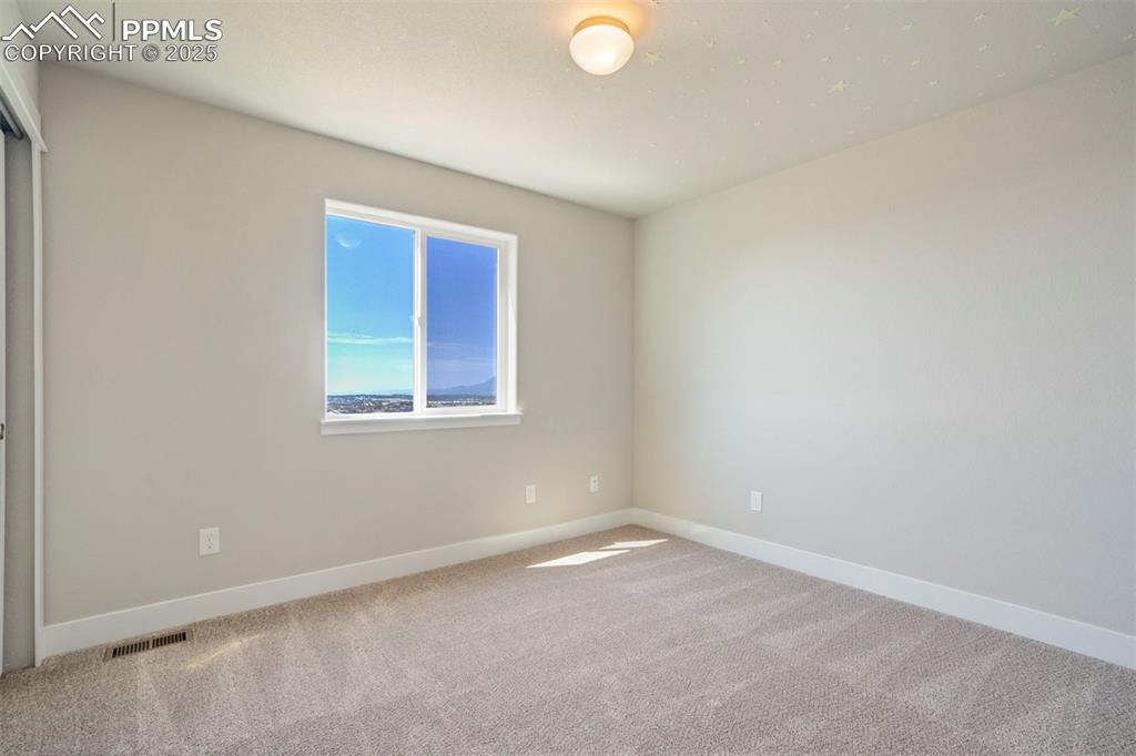 5633 Makalu Drive Colorado Springs, CO 80924 - Photo 33 of 48 an empty room with a window