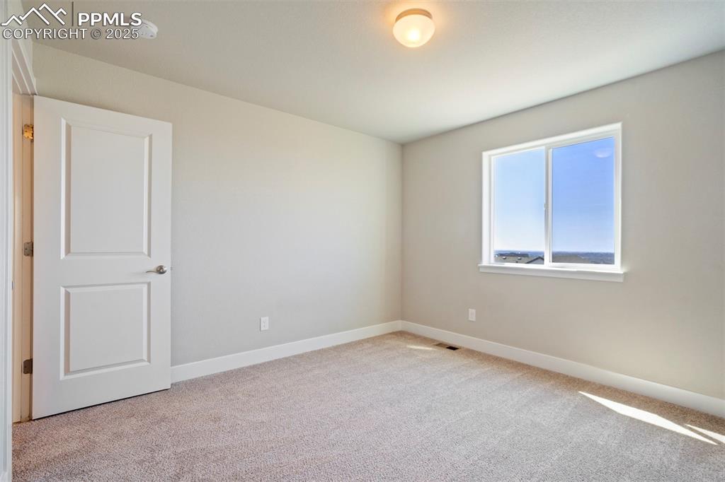 5633 Makalu Drive Colorado Springs, CO 80924 - Photo 38 of 48 a view of an empty room with a window